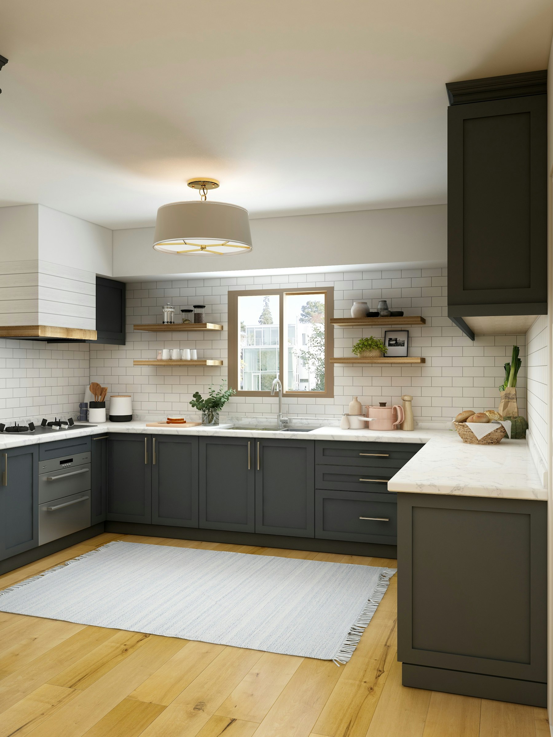 A kitchen in deep green cabinetry with open timber shelving and a stone worktop.